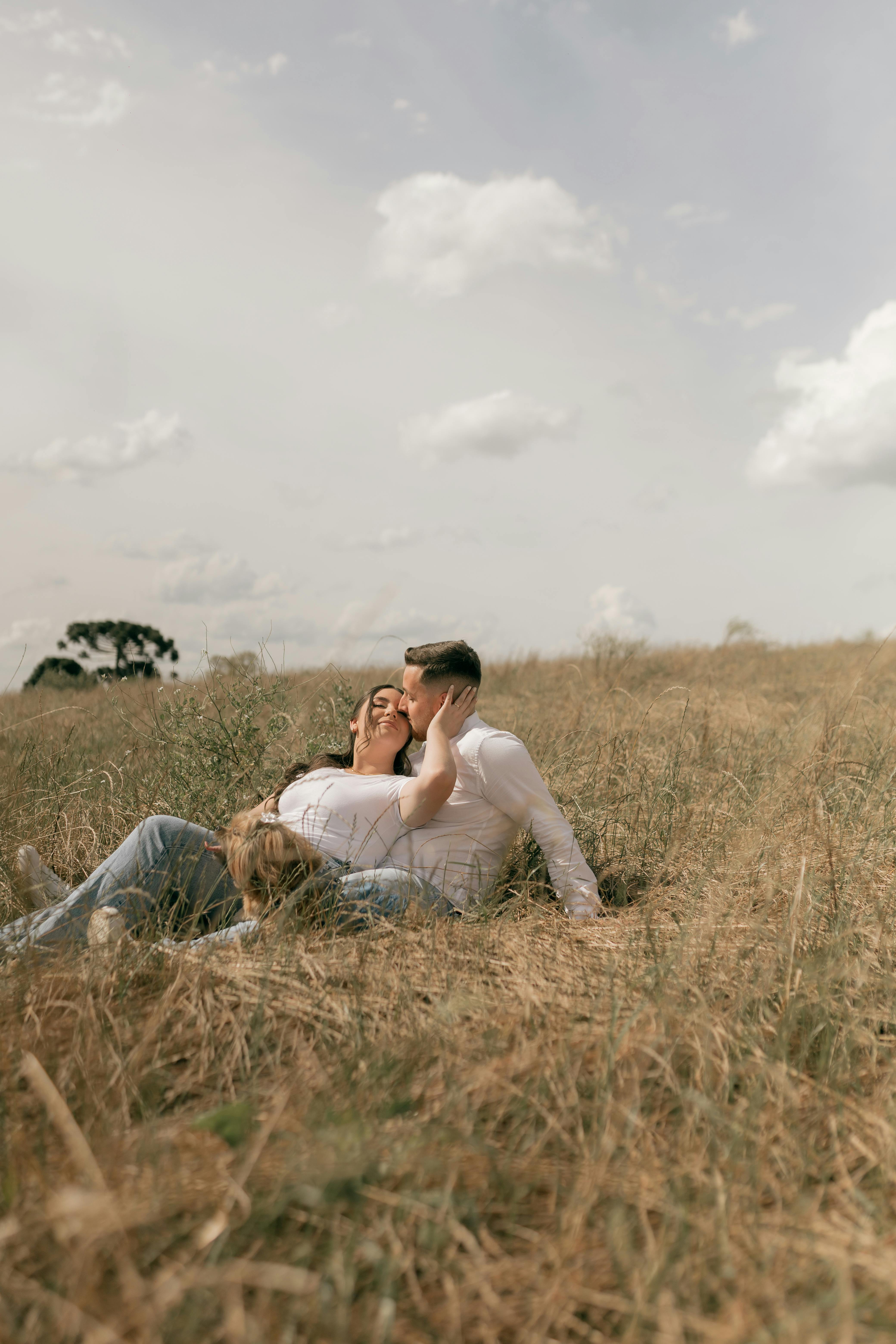 Romantic Couple Relaxing in Sunny Meadow