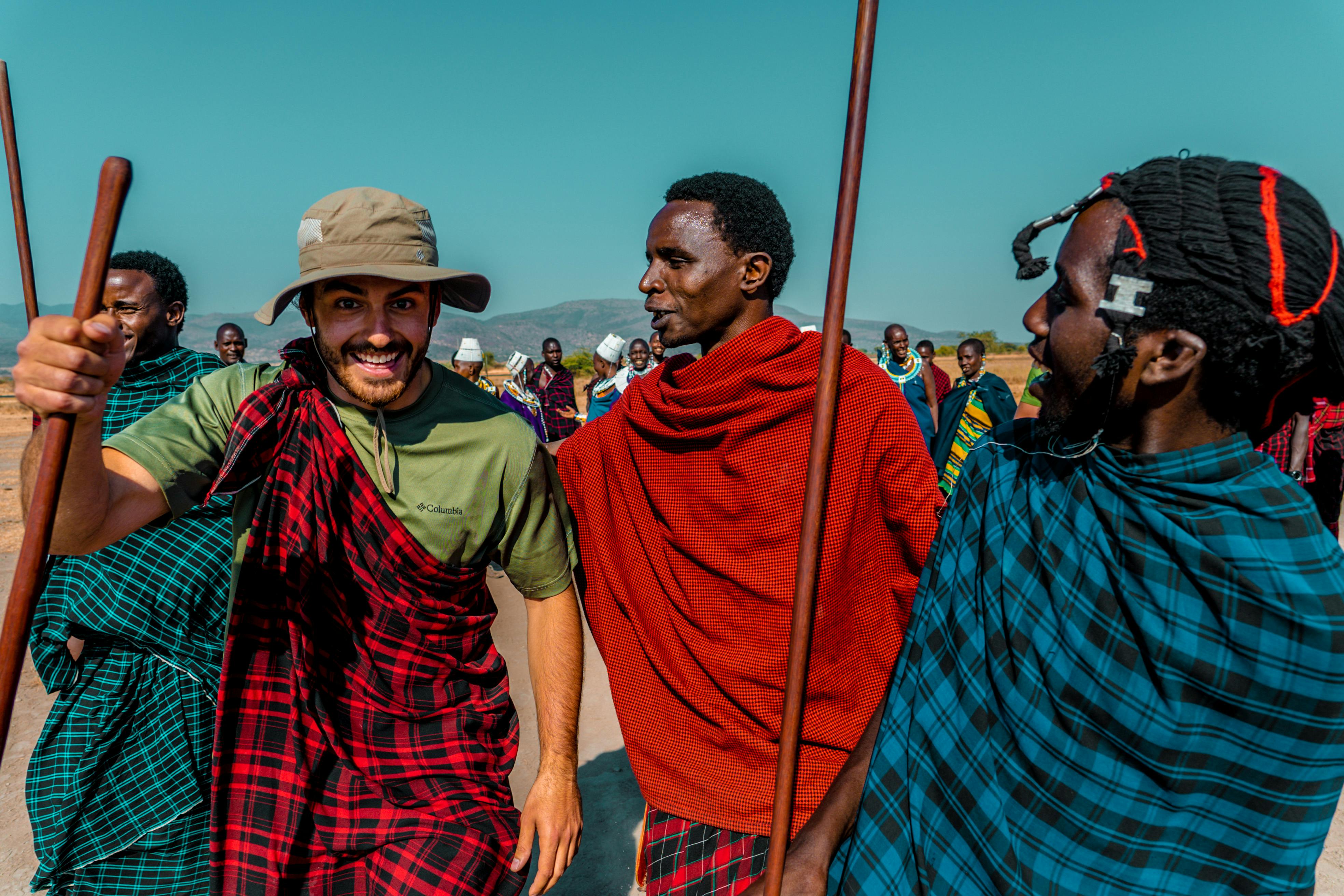 A vibrant display of Maasai culture with people in traditional attire in Arusha, Tanzania