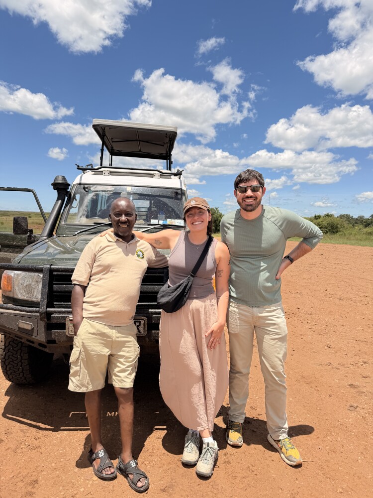 Beyond the Plains Safaris guide with clients beside a safari Land Cruiser in Kenya