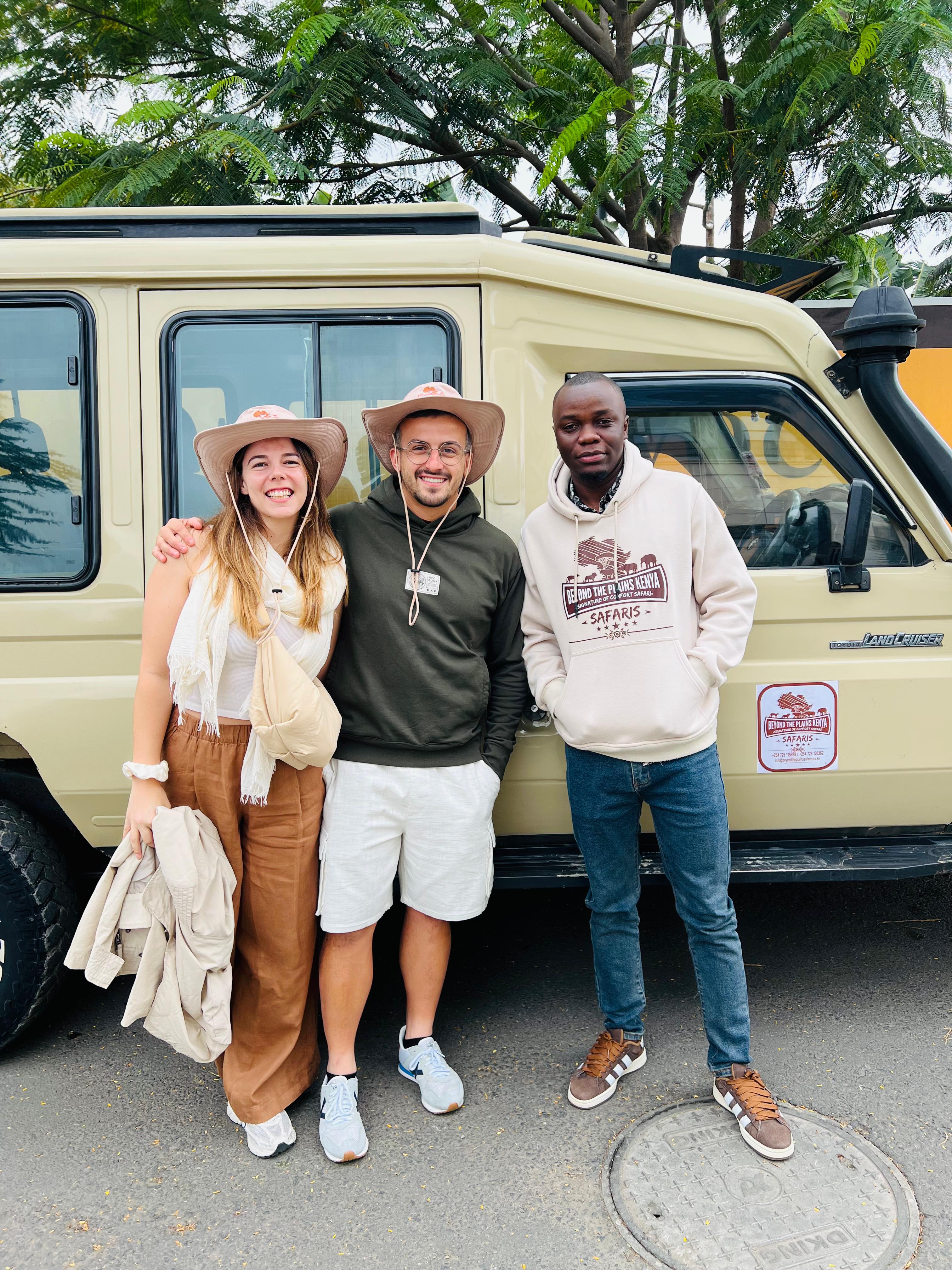 Beyond the Plains Safaris Kenya tour operator &mdash; clients with guide and branded Land Cruiser safari vehicle in Nairobi