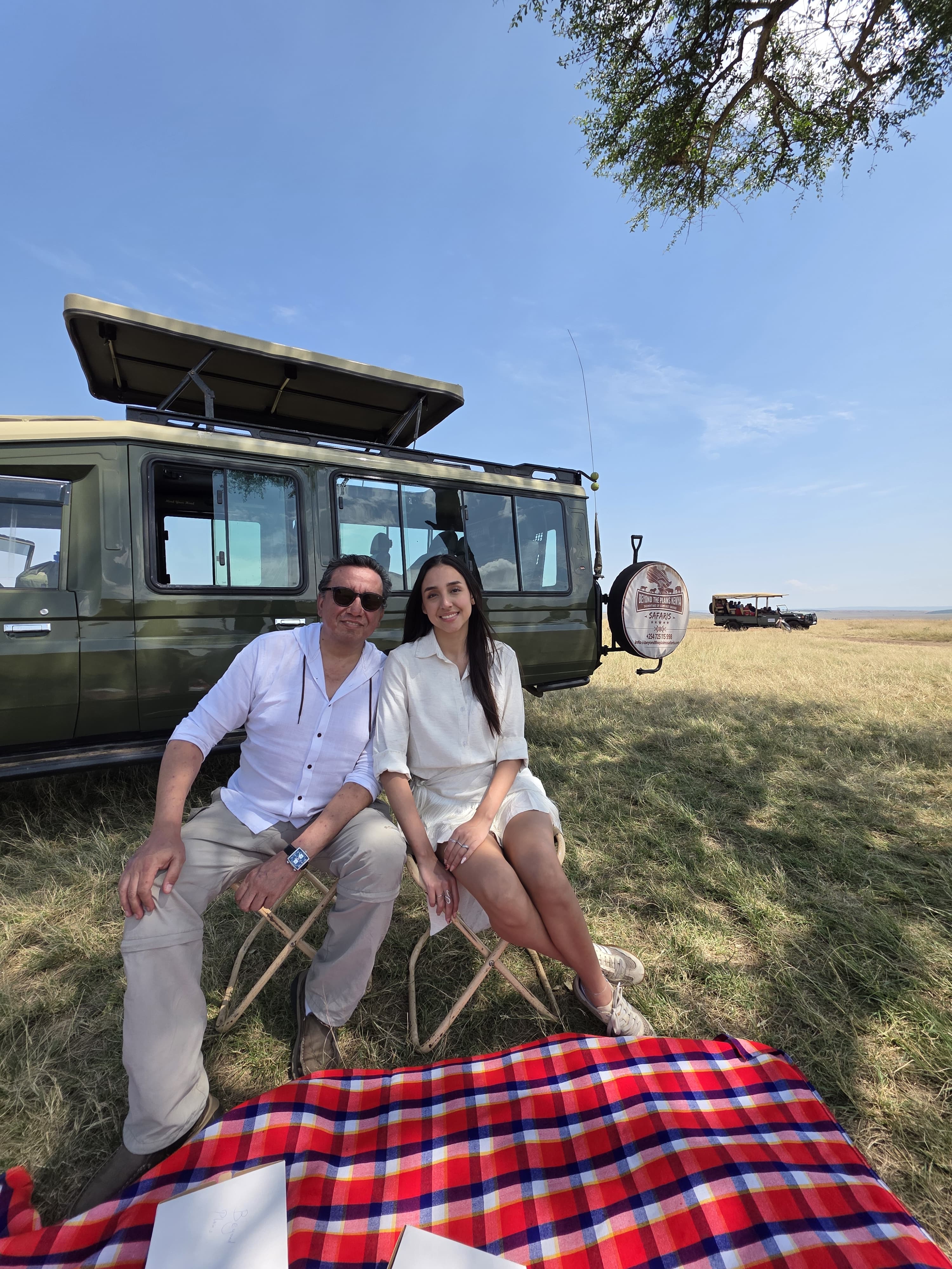 Guests relax at a private bush stop during a boutique DMC safari in the Maasai Mara