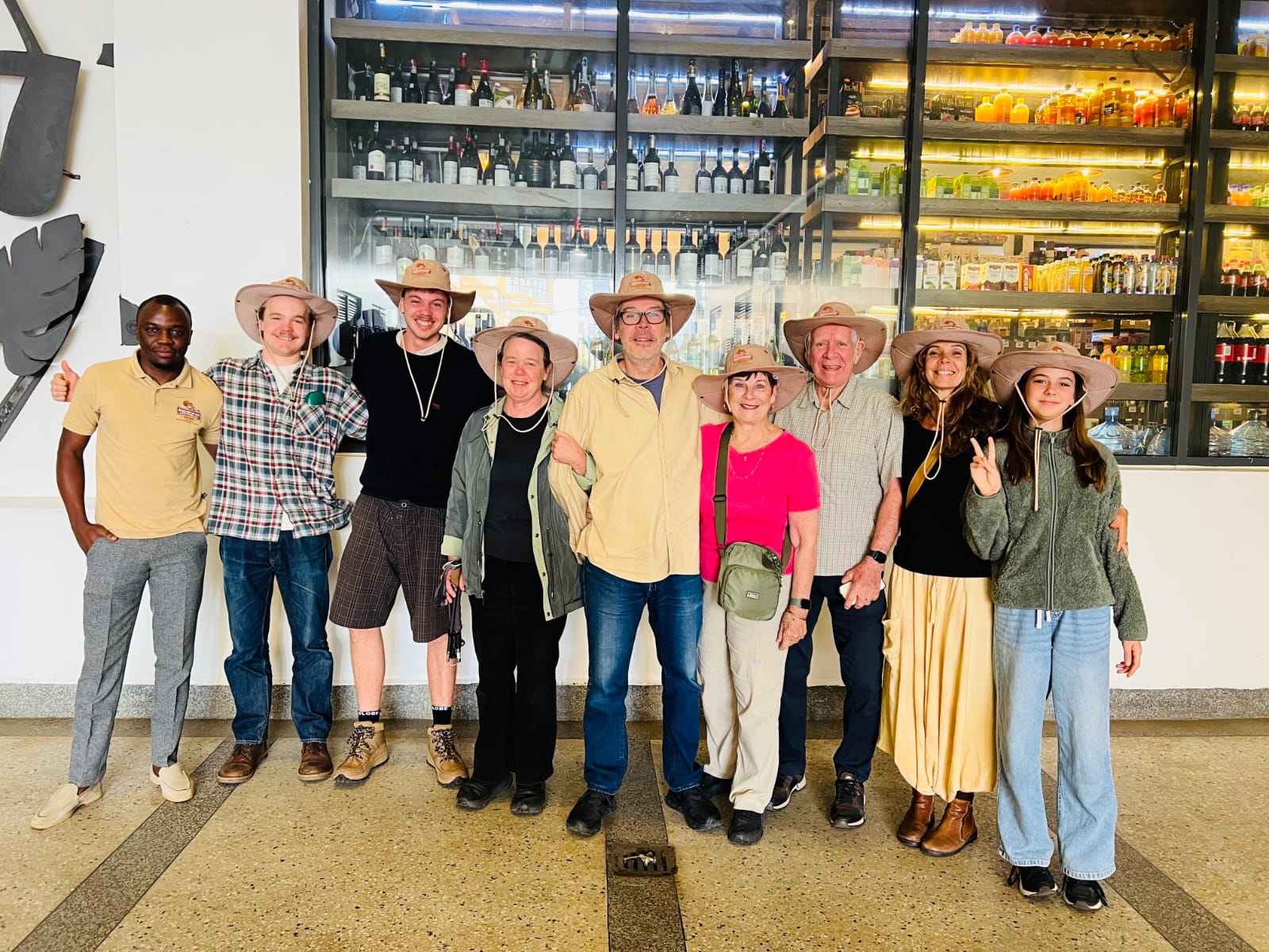 A multi-generational family group poses together before departing on a Kenya safari