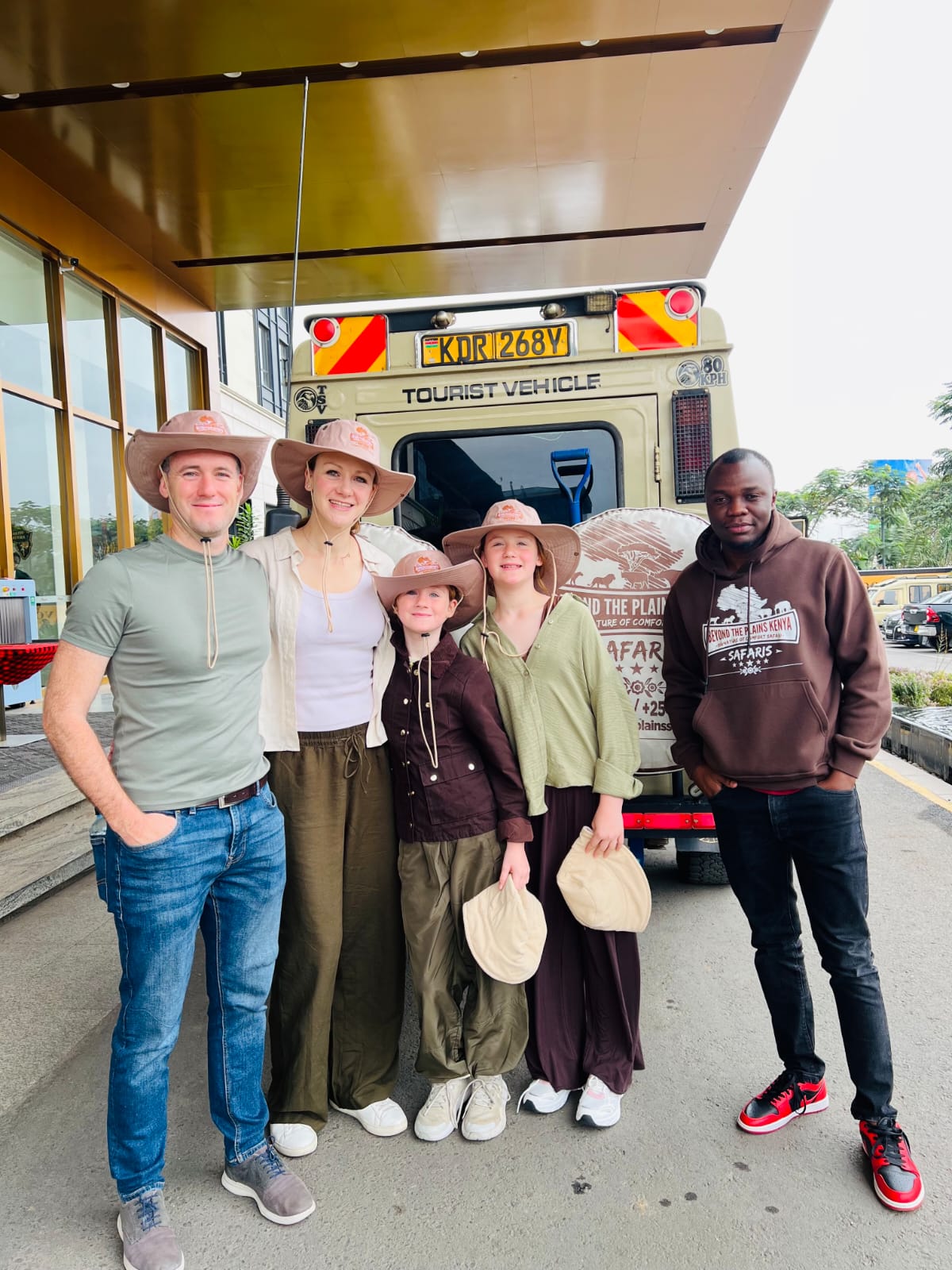Family greeted by Beyond the Plains Safaris guide before Kenya safari departure