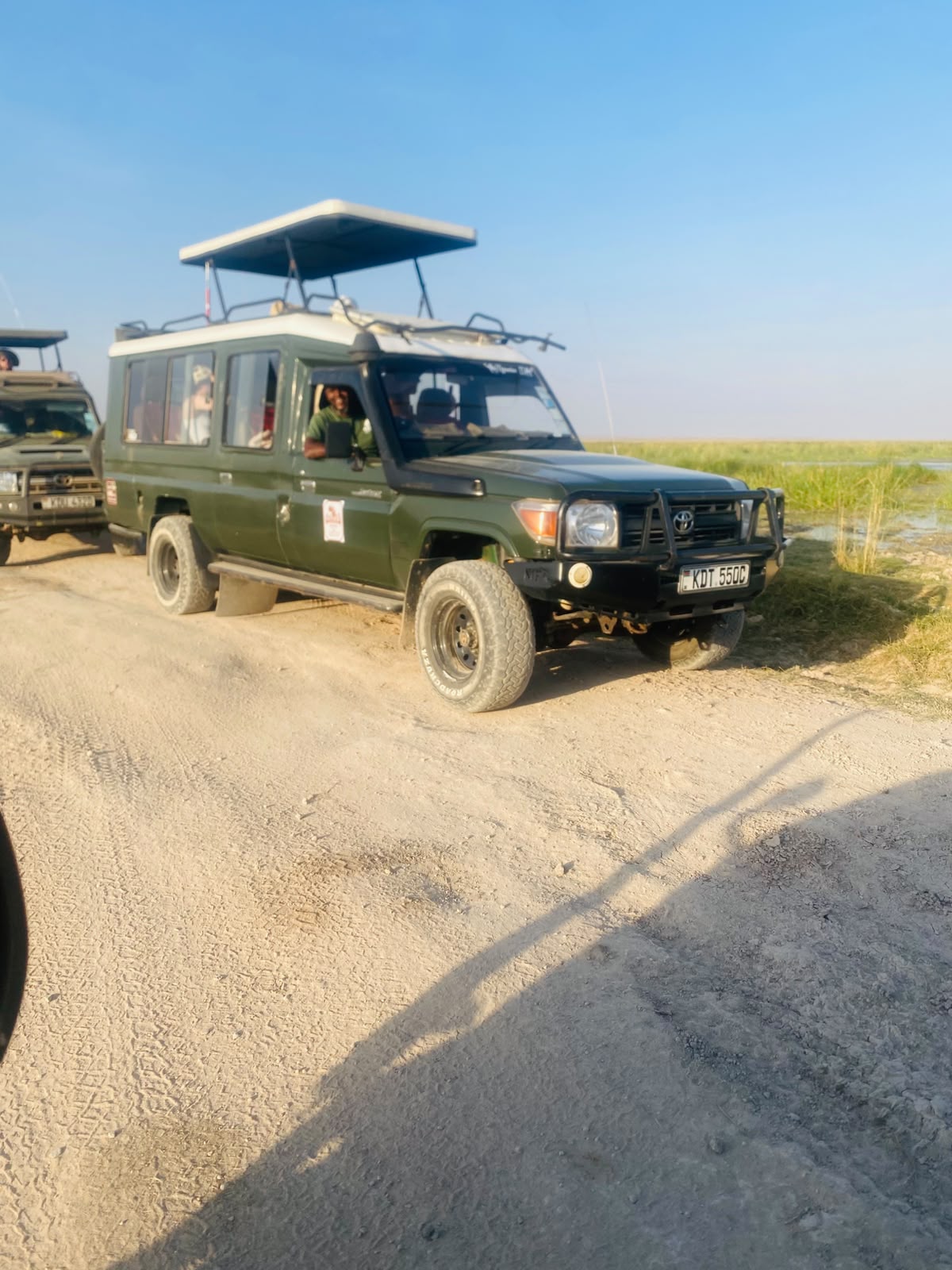 Toyota Land Cruiser safari vehicle with pop-up roof on Kenya game drive