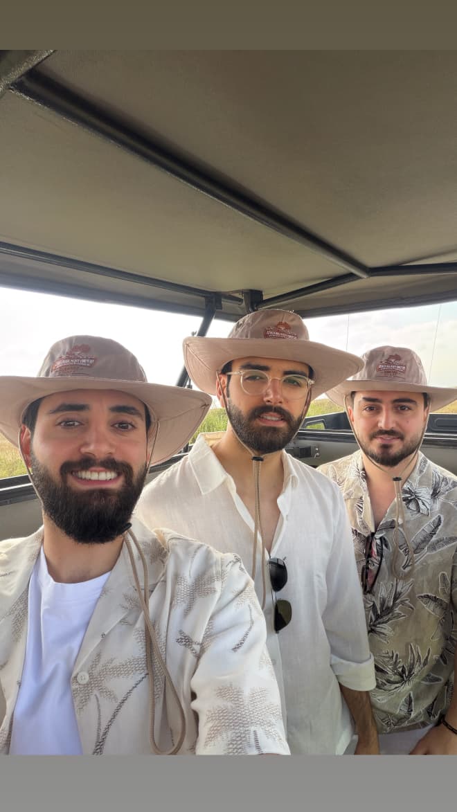 Travelers on game drive in Kenya safari vehicle