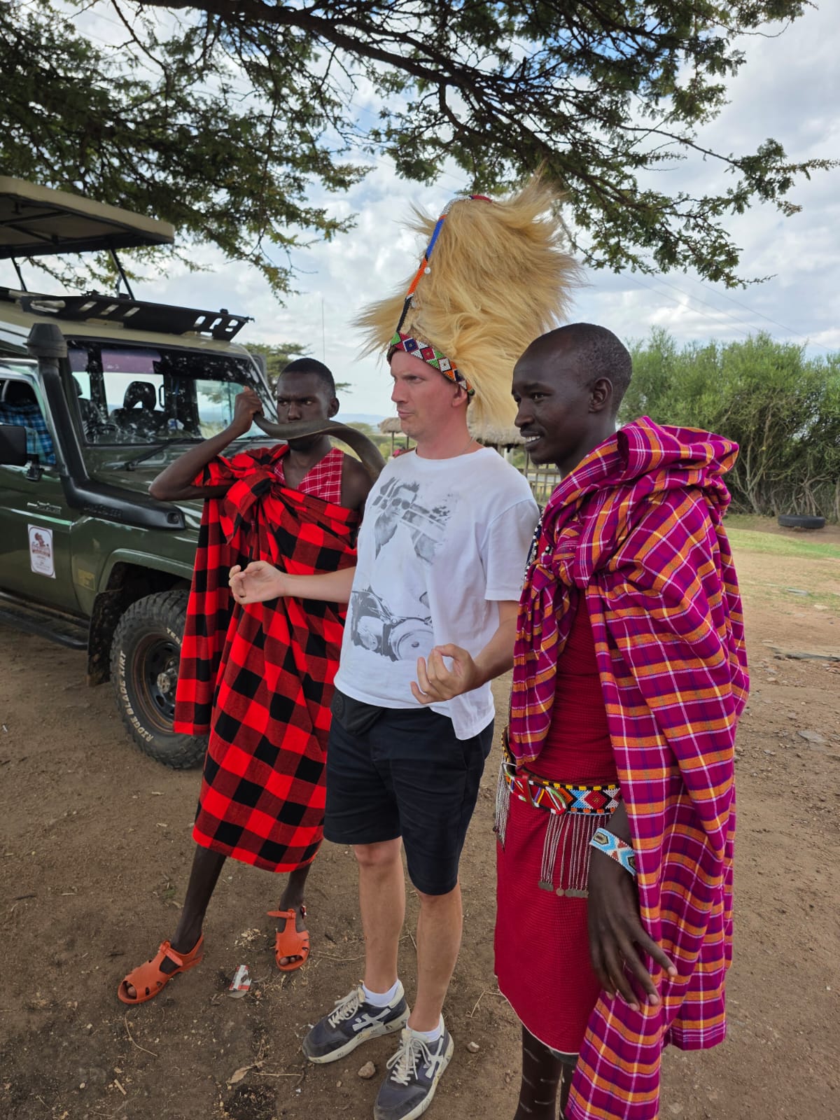 Traveler meeting Maasai warriors during a Kenya safari from Dubai